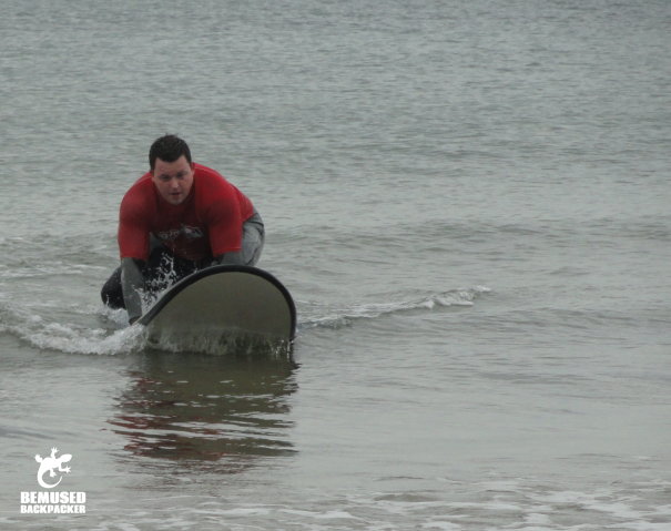 Learning to surf Caswell Bay Wales