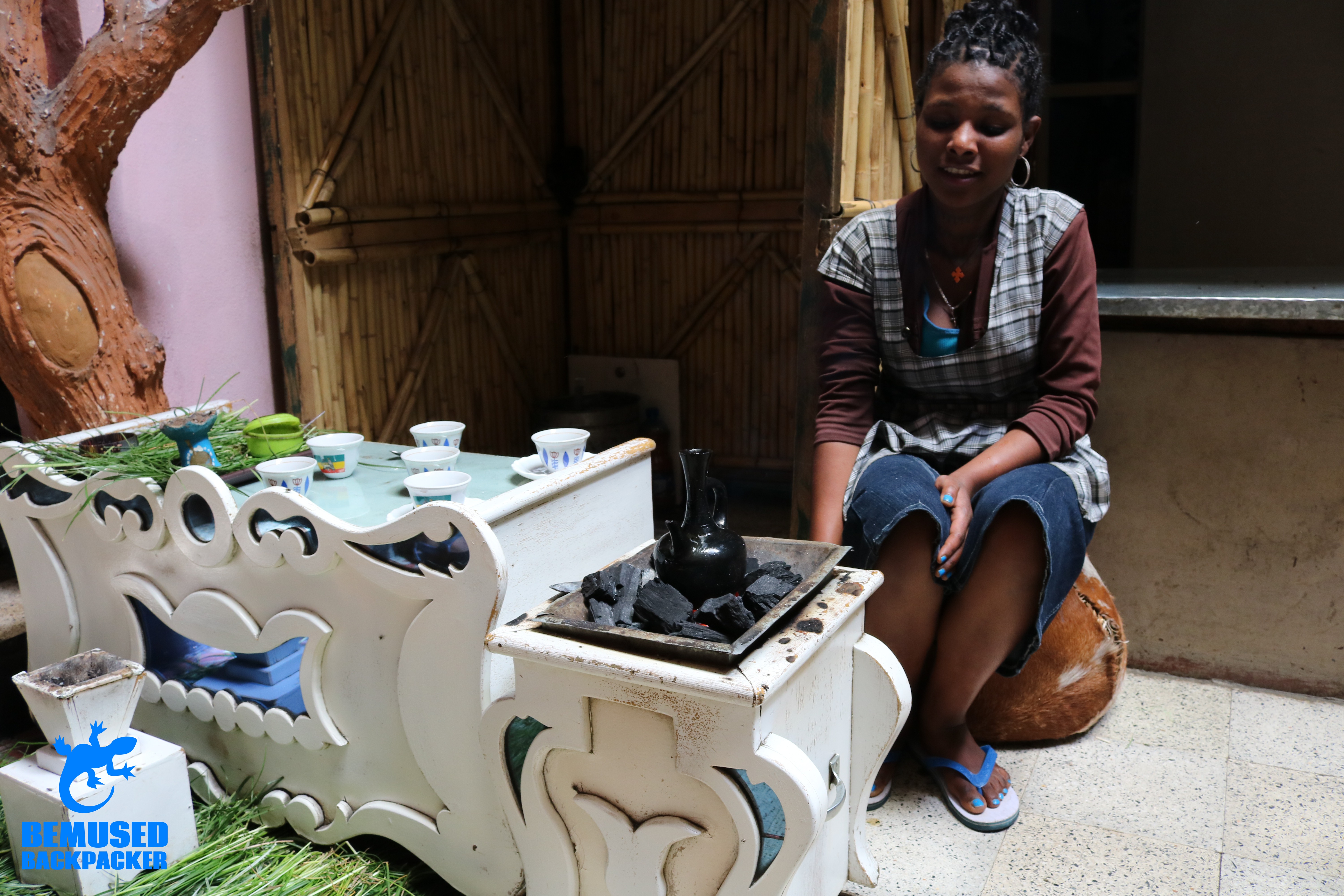 Girl perorming Coffee Ceremony Ethiopia